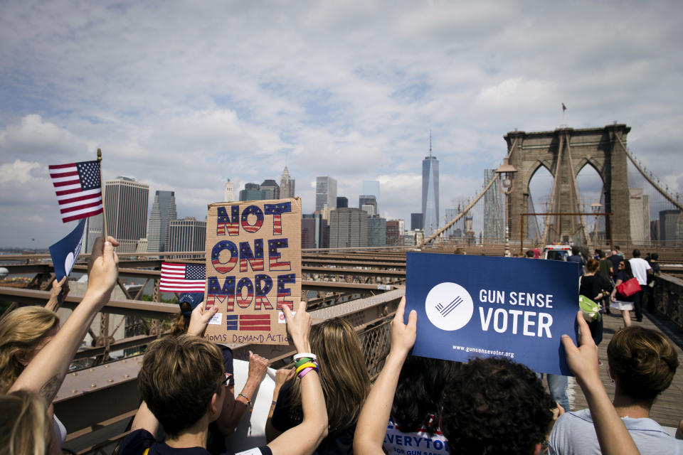 File-This photo from Saturday, June 14, 2014, in New York, shows anti-gun demonstrators-- underwritten by former New York Mayor Michael Bloomberg, with signs calling for tougher gun control laws as they march across the Brooklyn Bridge in New York. Bloomberg co-founded Mayors Against Illegal Guns--now part of his Everytown for Gun Safety advocacy group, and has given millions of dollars to pro-gun control candidates. (AP Photo/John Minchillo, File)