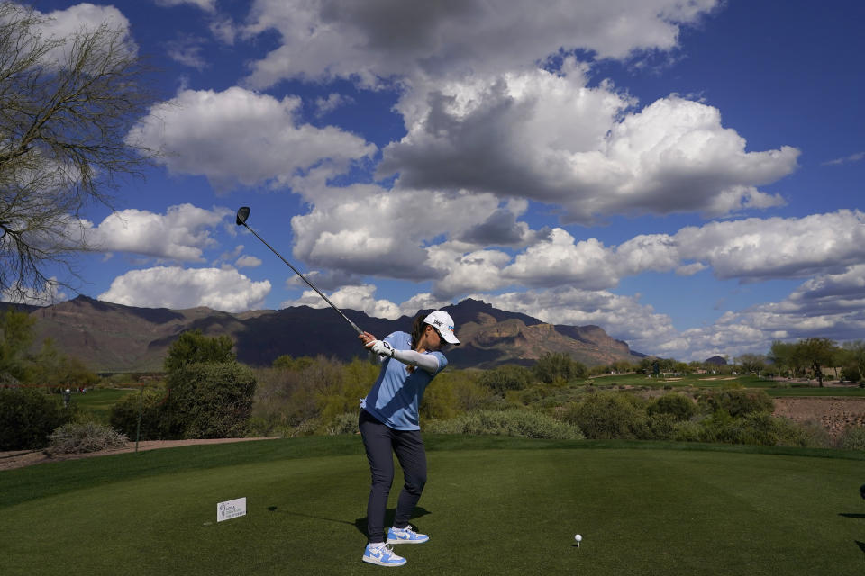 Mina Harigae hits from the 15th tee during the first round of the Drive On Championship golf tournament, Thursday, March 23, 2023, in Gold Canyon, Ariz. (AP Photo/Matt York)