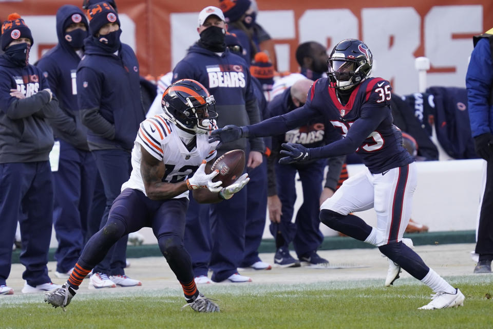 Chicago Bears' Allen Robinson (12) makes a catch against Houston Texans' Keion Crossen (35) during the first half of an NFL football game, Sunday, Dec. 13, 2020, in Chicago. (AP Photo/Charles Rex Arbogast)