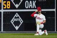 Philadelphia Phillies right fielder Bryce Harper adjusts his hat during the fourth inning of an interleague baseball game against the Baltimore Orioles, Tuesday, Sept. 21, 2021, in Philadelphia. (AP Photo/Matt Slocum)