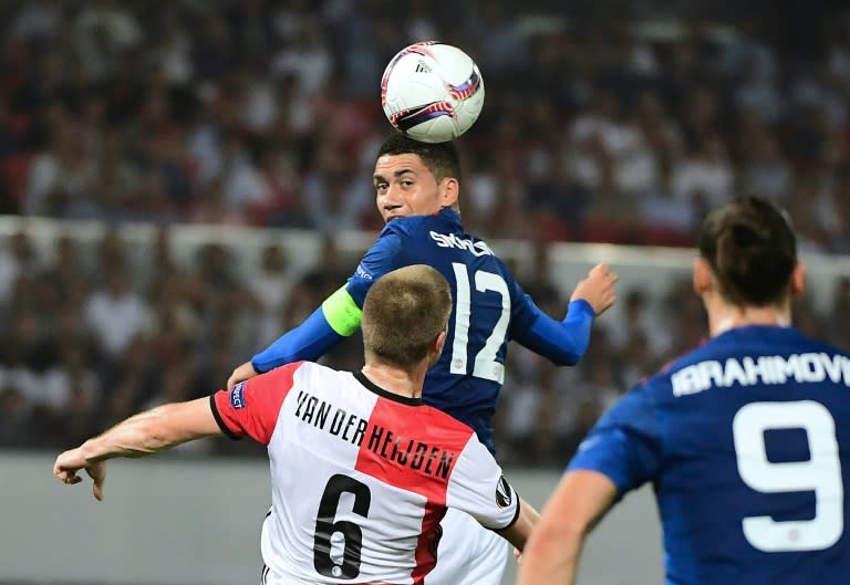 Manchester United's Chris Smalling heads the ball during their UEFA Europa League Group A match against Feyenoord Rotterdam, at the Feyenoord Stadium in Rotterdam, on September 15, 2016