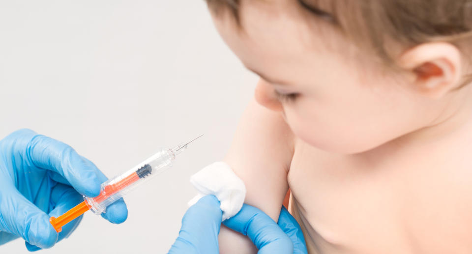 Hattie Gladwell's son stopped breathing after having a bad reaction to his vaccines. Here's why she's decided to keep vaccinating him. Image via Getty Images. 