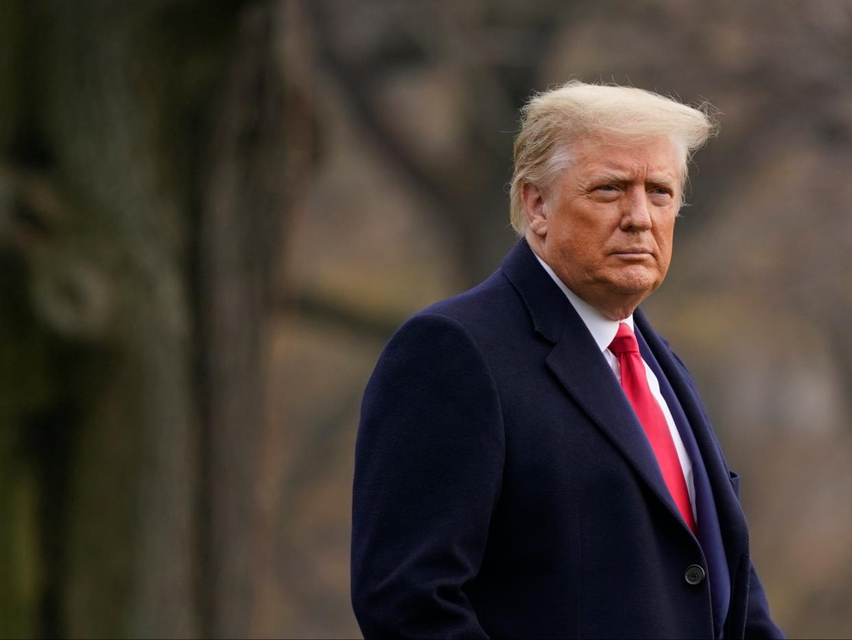 President Donald Trump walks on the South Lawn of the White House in Washington before boarding Marine One (AP)