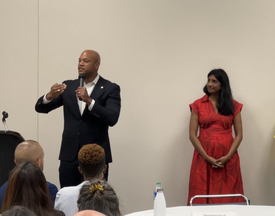 Gov. Wes Moore speaks at the Maryland Municipal League Conference in Ocean City on June 27, 2023 before a meeting of his cabinet secretaries and local elected officials. Lt. Gov. Aruna Miller, at right, looks on.