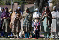 Muslim women perform an Eid al-Fitr prayer in an outdoor open area, marking the end of the fasting month of Ramadan, Thursday, May 13, 2021 in Morton Grove, Ill. (AP Photo/Shafkat Anowar)