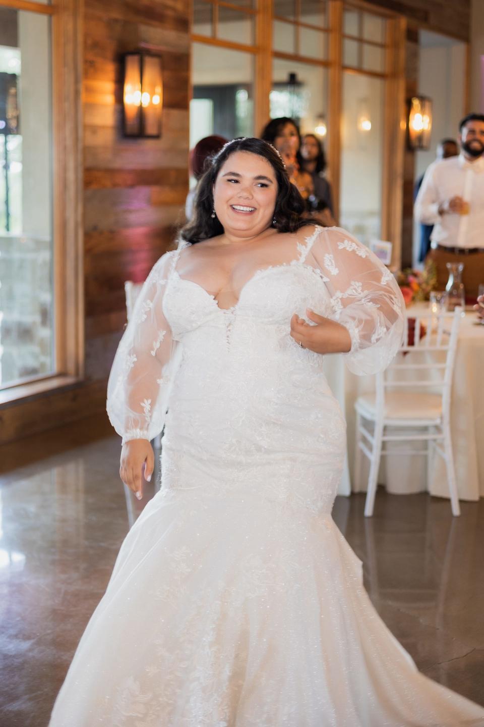 A bride smiles during her wedding reception.