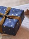 <p>Made using bark from Nepalese mulberry bushes, this handmade wrapping paper has a soft, natural texture that will add a tactile quality to your gifts. Its moody starry night pattern makes a refreshing change from cheery reds. £3 per sheet, <a href="https://www.rowenandwren.co.uk/products/handmade-folk-wrapping-paper-night-sky" rel="nofollow noopener" target="_blank" data-ylk="slk:rowenandwren.co.uk;elm:context_link;itc:0;sec:content-canvas" class="link ">rowenandwren.co.uk</a></p>