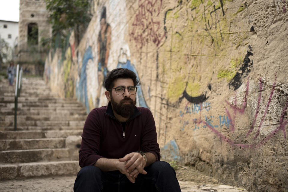 Lawyer Amal Oraby poses for a portrait in Wadi Salib, a Palestinian area of Haifa, Israel where residents were forced to flee during the 1948 Arab-Israeli war, Wednesday, March 22, 2023. Oraby is usually a fixture at street protests. But as tens of thousands of Israelis fill the streets around the country against a contentious government plan to overhaul the judiciary, Oraby, an activist and lawyer, is sitting this one out. "Let's just say I am sensitive to Israeli flags, to this many Israeli flags," the Palestinian citizen of Israel says. (AP Photo/Maya Alleruzzo)