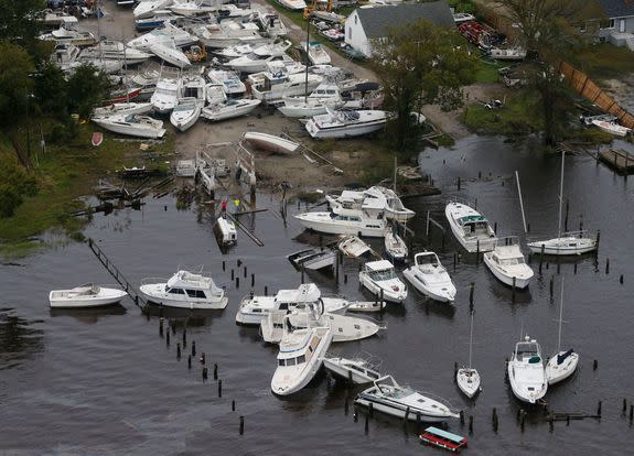 Boats are stacked up on each other in a marina as a result from Florence in New Bern, North Carolina.