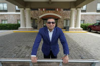 Vimal Patel president of Q Hotels, poses for a photograph at his Holiday Inn Express Hotel in LaPlace, La., Wednesday, June 23, 2021. (AP Photo/Gerald Herbert)