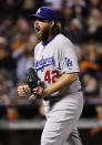 Los Angeles Dodgers reliever Chris Perez reacts as San Francisco Giants' Brandon Hicks hits into a double play to end the eighth inning of a baseball game on Tuesday, April 15, 2014, in San Francisco. (AP Photo/Marcio Jose Sanchez)