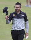 South Africa's Louis Oosthuizen acknowledges the crowd as he walks onto the 18th green during the first round British Open Golf Championship at Royal St George's golf course Sandwich, England, Thursday, July 15, 2021. (AP Photo/Ian Walton)