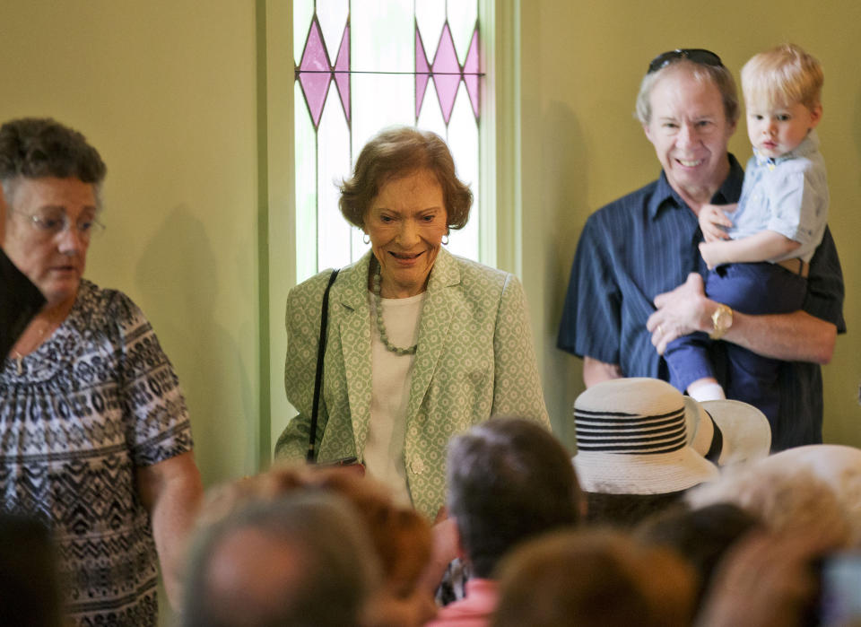 Rosalynn Carter, center, wife of former President Jimmy Carter arrives to attend Sunday School class taught by her husband at the Maranatha Baptist Church in his hometown on Aug. 23, 2015, in Plains, Ga. (AP Photo/David Goldman)