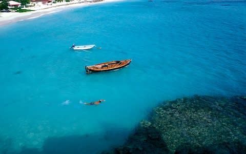 Man snorkelling in St. Barts - Credit: Getty