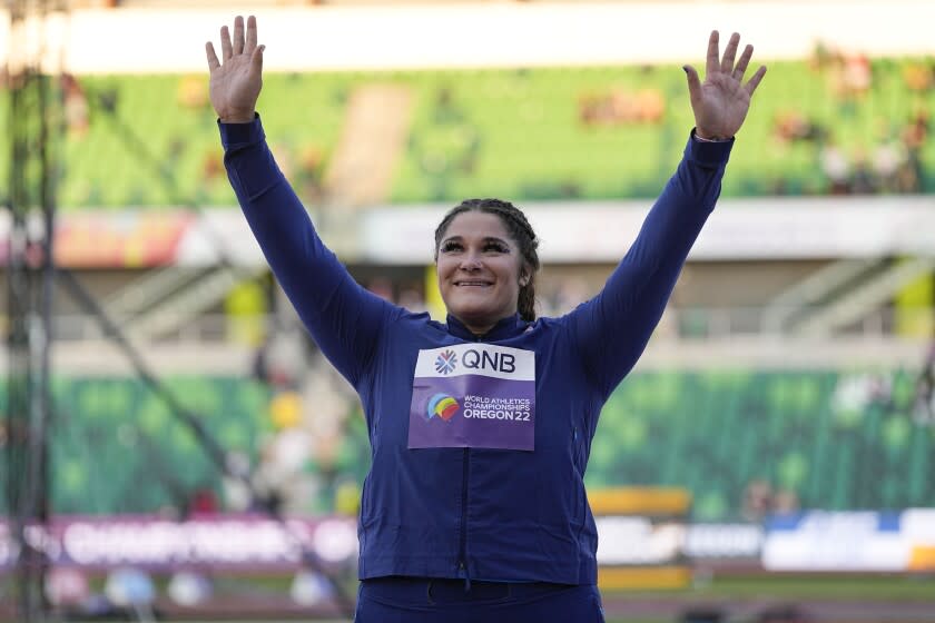 Gold medalist Chase Ealey, of the United States celebrates after a medal ceremony for the women's shot put final at the World Athletics Championships on Saturday, July 16, 2022, in Eugene, Ore. (AP Photo/David J. Phillip)