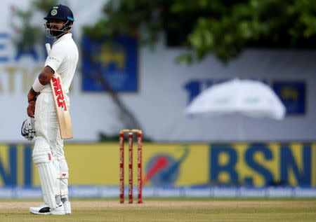 REFILE - QUALITY REPEAT Cricket - Sri Lanka v India - First Test Match - Galle, Sri Lanka - July 26, 2017 - India's cricket captain Virat Kohli reacts as he waits for the decision for his dismissal by Sri Lanka's Nuwan Pradeep (not pictured). REUTERS/Dinuka Liyanawatte