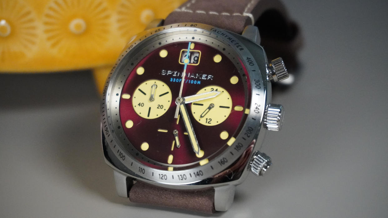  The Spinnaker Hull Chronograph against a yellow plant pot. 