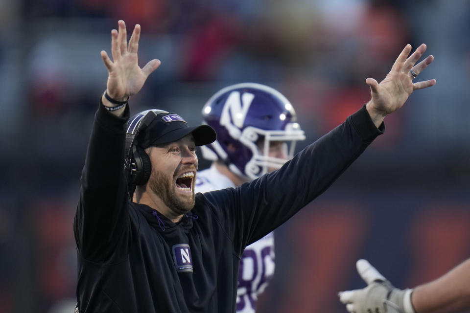Northwestern head coach David Braun throws up his hands after Illinois offensive lineman Dom D'Antonio recovered a fumble to score a touchdown during the first half of an NCAA college football game Saturday, Nov. 25, 2023, in Champaign, Ill. (AP Photo/Erin Hooley)