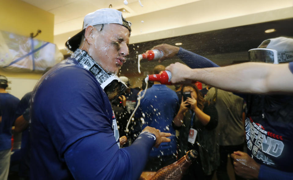 The Los Angeles Dodgers celebrate clinching a playoff spot after beating the San Francisco Giants in a baseball game in San Francisco, Saturday, Sept. 29, 2018. (AP Photo/Jim Gensheimer)