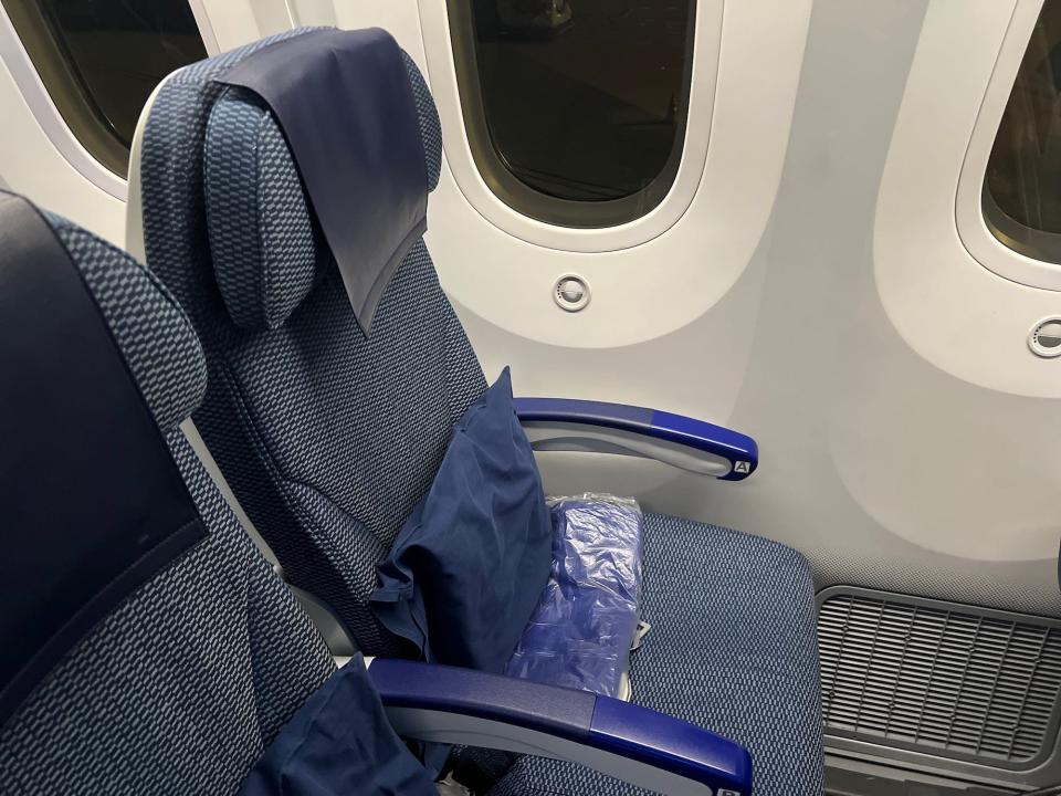 The author's economy class seat on ANA's Boeing 787. The seat is blue.