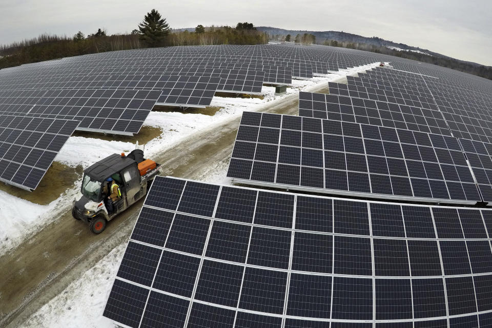 Solar panels stretch across 38 acres at the BNRG/Dirigo solar farm, Thursday, Jan. 14, 2021, in Oxford, Maine. President Joe Biden wants to change the way the U.S. uses energy by expanding renewables, but faces several challenges. (AP Photo/Robert F. Bukaty)