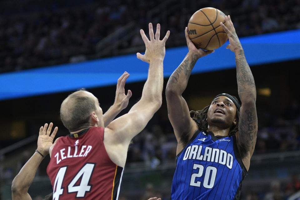 Orlando Magic guard Markelle Fultz (20) shoots in front of Miami Heat center Cody Zeller (44) during the first half of an NBA basketball game, Saturday, March 11, 2023, in Orlando, Fla. (AP Photo/Phelan M. Ebenhack)