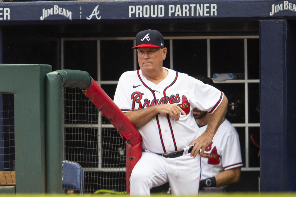 Atlanta Braves manager Brian Snitker watches from the dugout in the fourth inning of a baseball against the Miami Marlins, Sunday, Sept. 4, 2022, in Atlanta. (AP Photo/Hakim Wright Sr.)