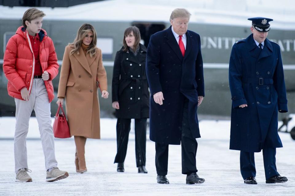 Barron Trump (left) with his parents in February | BRENDAN SMIALOWSKI/AFP/Getty Images