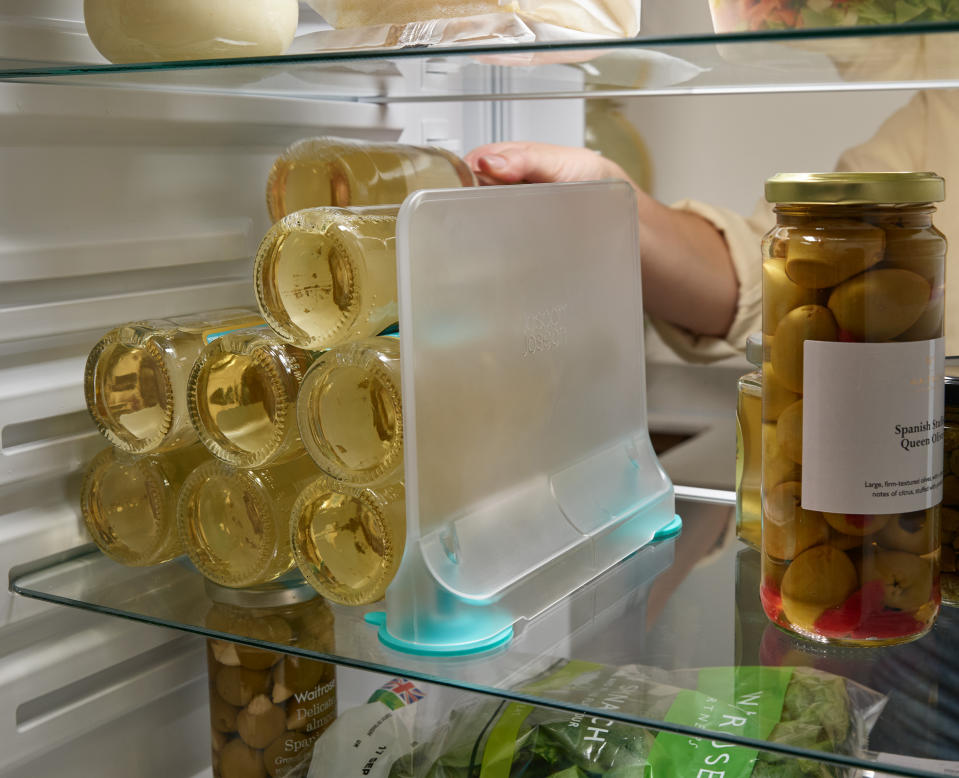 an organized fridge with storage drawers and dividers