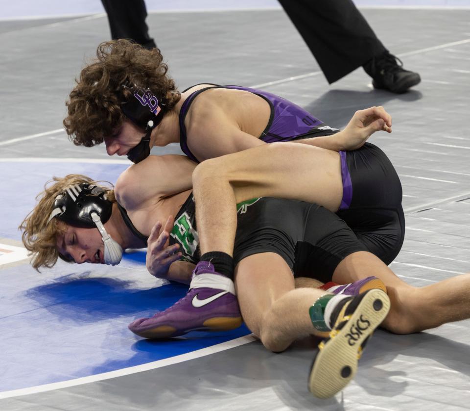 Old Bridge Logan Roman works on Camden Catholic Dom Digiacomo during their 113 lbs. bout. Day One at NSIAA Wrestling Championships in Atlantic City on March 2, 2023. 