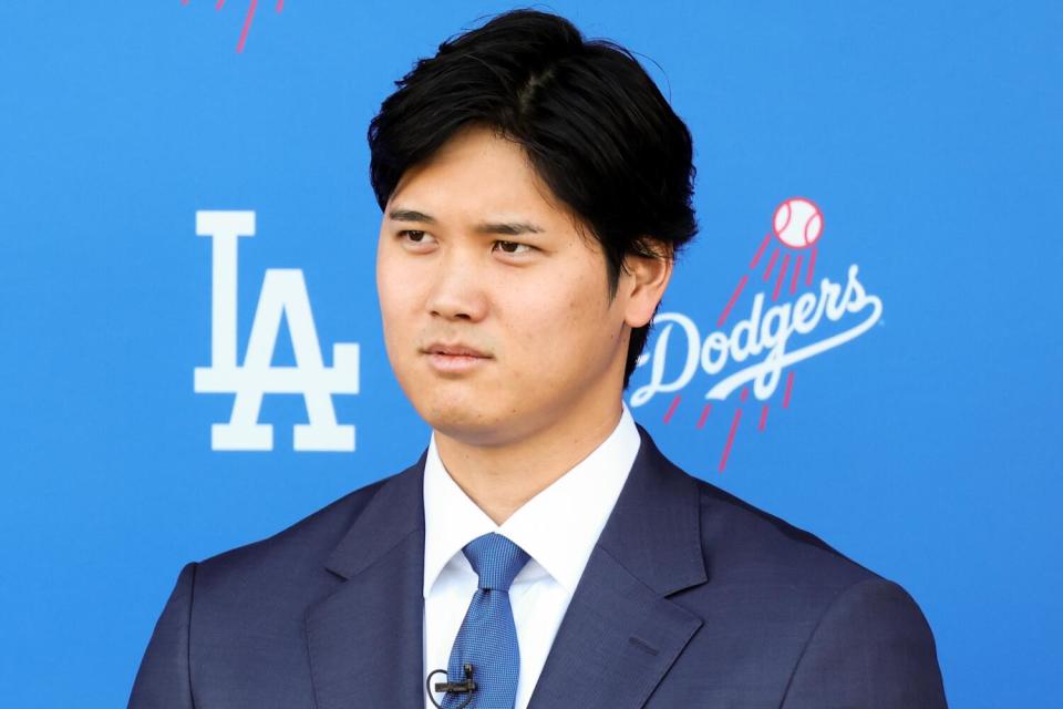 Shohei Ohtani is introduced as a member of the Dodgers during a news conference on Thursday.