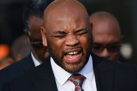 Pastor Marcus King with the Disciple Central Community Church gives a unity prayer at the prayer vigil held outside the Frank Crowley Courts Building on the first day of the trial against former police officer Amber Guyger in Dallas