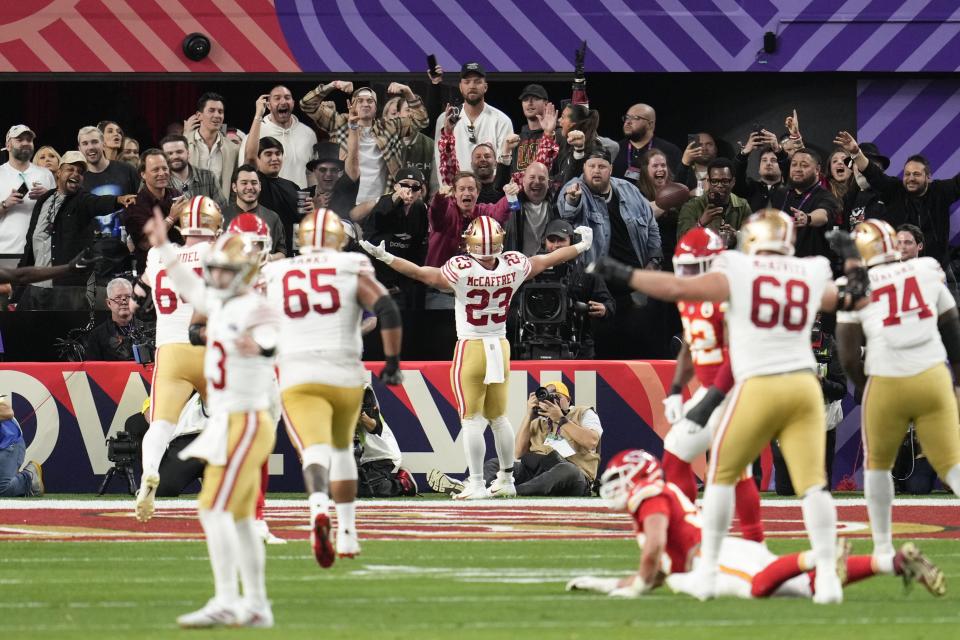 San Francisco 49ers running back Christian McCaffrey (23) celebrates a touchdown against the Kansas City Chiefs during the first half of the NFL Super Bowl 58 football game Sunday, Feb. 11, 2024, in Las Vegas. (AP Photo/Abbie Parr)