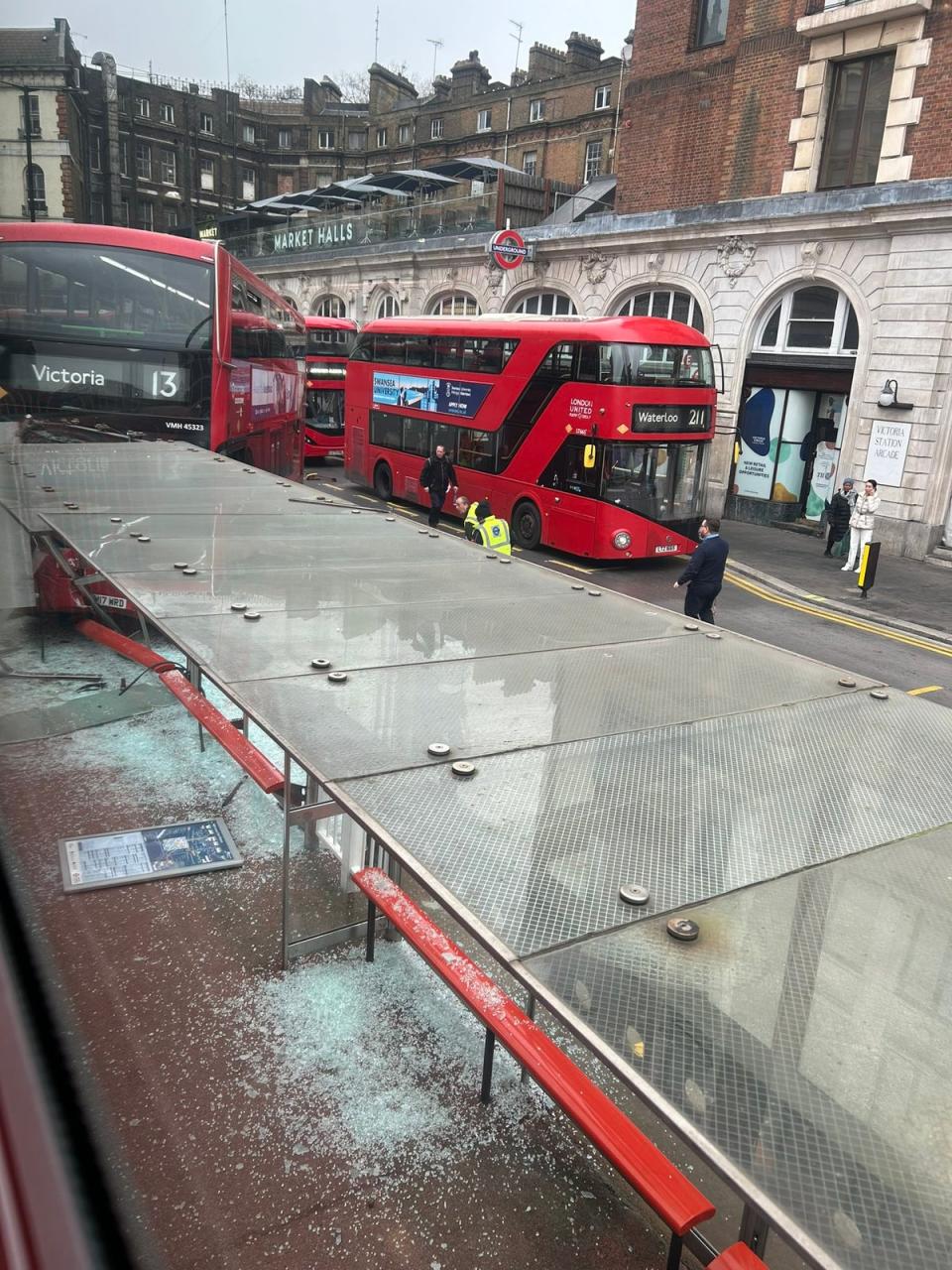 A photo of the scene showed a number 13 had crashed into the bus station (PA)