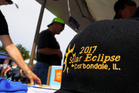 The Rotary Club sells commemorative baseball caps in Carbondale, Illinois, U.S., August 20, 2017, one day before the total solar eclipse. REUTERS/Brian Snyder