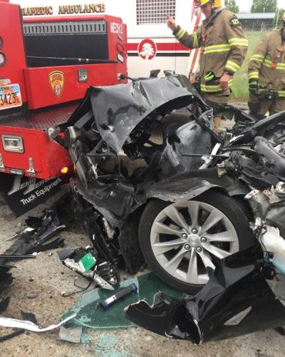 The Tesla Model S is seen after it hit the back of a firetruck in South Jordan, Utah.