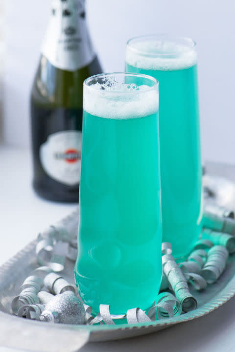 <p>Simple and sweet: Add a hint of pineapple juice and blue curacao to sparkling wine for this blue-hued libation. </p><p><strong>Get the recipe at <a rel="nofollow noopener" href="http://suziesweettooth.com/2014/12/28/new-years-eve-champagne-cocktails/" target="_blank" data-ylk="slk:Suzie Sweet Tooth;elm:context_link;itc:0;sec:content-canvas" class="link ">Suzie Sweet Tooth</a>. </strong></p>