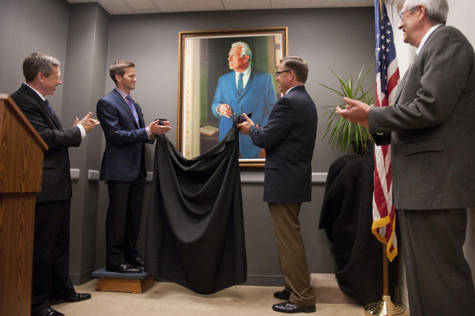 UNITED STATES - SEPTEMBER 22: From left, Sen. Mark Kirk, R-Ill., Reps. Aaron Schock, R-Ill., Bobby Schilling, R-Ill., and Senate Historian Donald Ritchie unveil a portrait of former Senate Minority Leader Everett Dirsken, R-Ill., which will reside in Kirk's Hart Building office. The portrait is a copy of Richard Harryman's 1968 original. (Photo By Tom Williams/Roll Call)