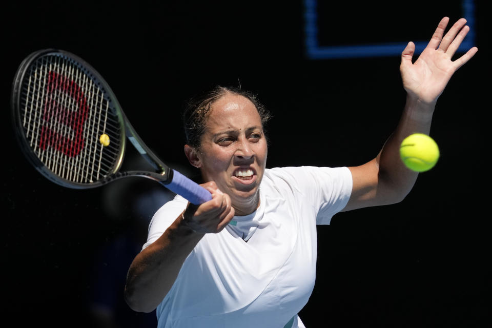 Madison Keys of the U.S. plays a forehand return to Paula Badosa of Spain during their fourth round match at the Australian Open tennis championships in Melbourne, Australia, Sunday, Jan. 23, 2022. (AP Photo/Simon Baker)