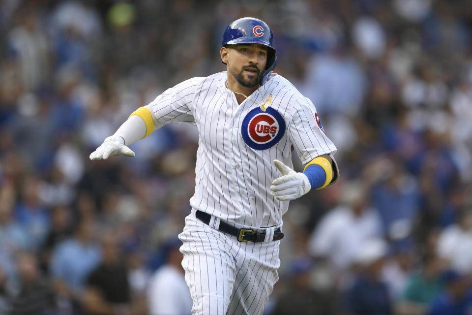 Chicago Cubs' Nicholas Castellanos celebrates after hitting a two-run home run during the first inning of a baseball game against the Pittsburgh Pirates, Friday, Sept. 13, 2019, in Chicago. (AP Photo/Paul Beaty)