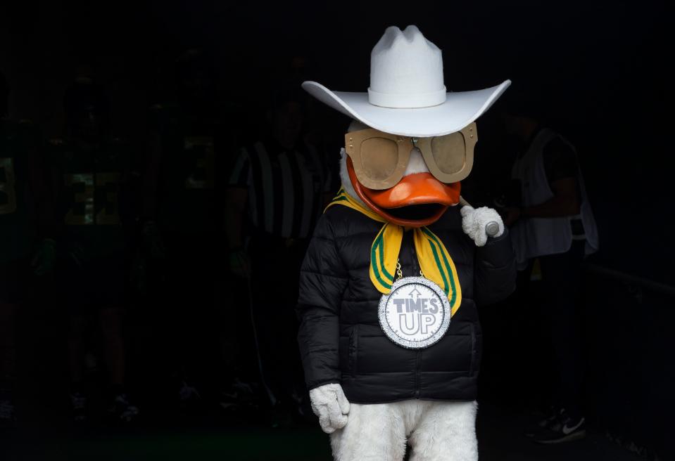The Oregon Duck emerges in Deion Sanders attire for the start of the game against Colorado in Eugene Saturday, Sept. 23, 2023.