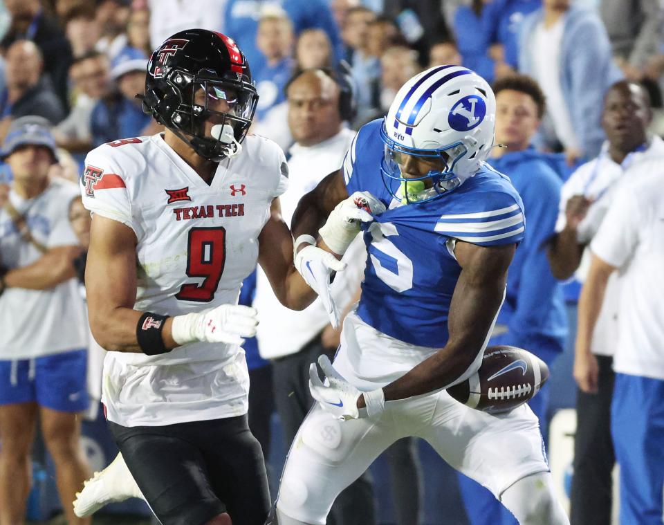 Brigham Young Cougars wide receiver Darius Lassiter (5) is held and can’t complete a catch against Texas Tech Red Raiders defensive back C.J. Baskerville (9) in Provo on Saturday, Oct. 21, 2023. BYU won 27-14. | Jeffrey D. Allred, Deseret News