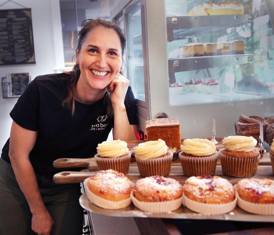 Rebekah Krieger, chef and owner of Two Bees Café + Patisserie, shows off her baked goods in the 100 First St. shop in Dover.
