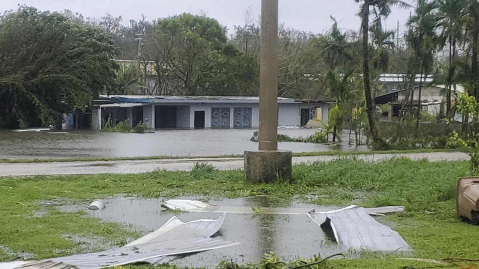 This photo provided by Alexander Ken M. Aflague shows flooding in Yona, Guam on Thursday, May 25, 2023 after the passage of Typhoon Mawar. Guam residents and officials emerged from homes and shelters Thursday to survey the damage done to the U.S. Pacific territory after Typhoon Mawar's howling winds shredded trees, flipped vehicles and knocked out utilities. (Alexander Ken M. Aflague via AP)