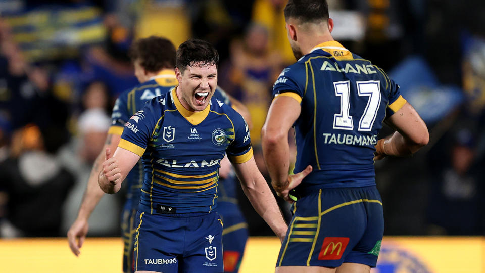 Eels players celebrate their win over the Gold Coast Titans.