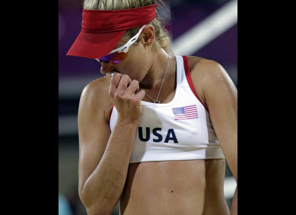 April Ross reacts near the end of a loss to Missy May Treanor and Kerri Walsh Jennings during the women's Gold Medal beach volleyball match between two United States teams at the 2012 Summer Olympics, Wednesday, Aug. 8, 2012, in London. 