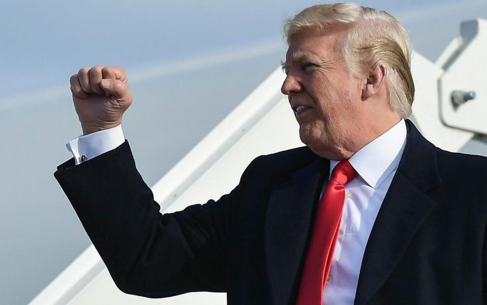 Donald Trump stepping off Air Force One - AFP