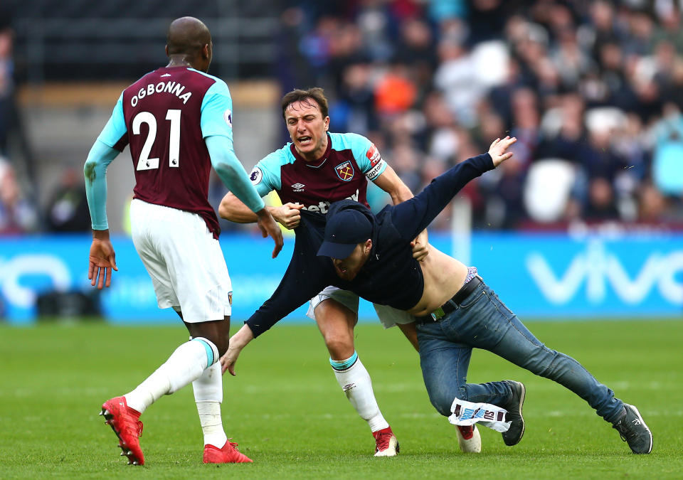Mark Noble dealt with the pitch invaders against Burnley in his own way