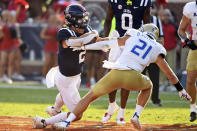 Tulsa safety Bryson Powers (21) tackles Mississippi quarterback Jaxson Dart (2) during the second half of an NCAA college football game in Oxford, Miss., Saturday, Sept. 24, 2022. Mississippi won 35-27. (AP Photo/Thomas Graning)