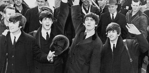 <span class="caption">The Beatles wave to fans after arriving at New York's Kennedy Airport in 1964.</span> <span class="attribution"><a class="link " href="https://commons.wikimedia.org/wiki/File:The_Beatles_in_America.JPG" rel="nofollow noopener" target="_blank" data-ylk="slk:US Library of Congress;elm:context_link;itc:0;sec:content-canvas">US Library of Congress</a></span>